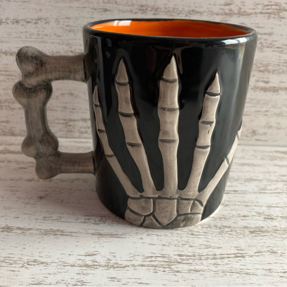 Skeleton Hand Coffee Mug Black and Orange